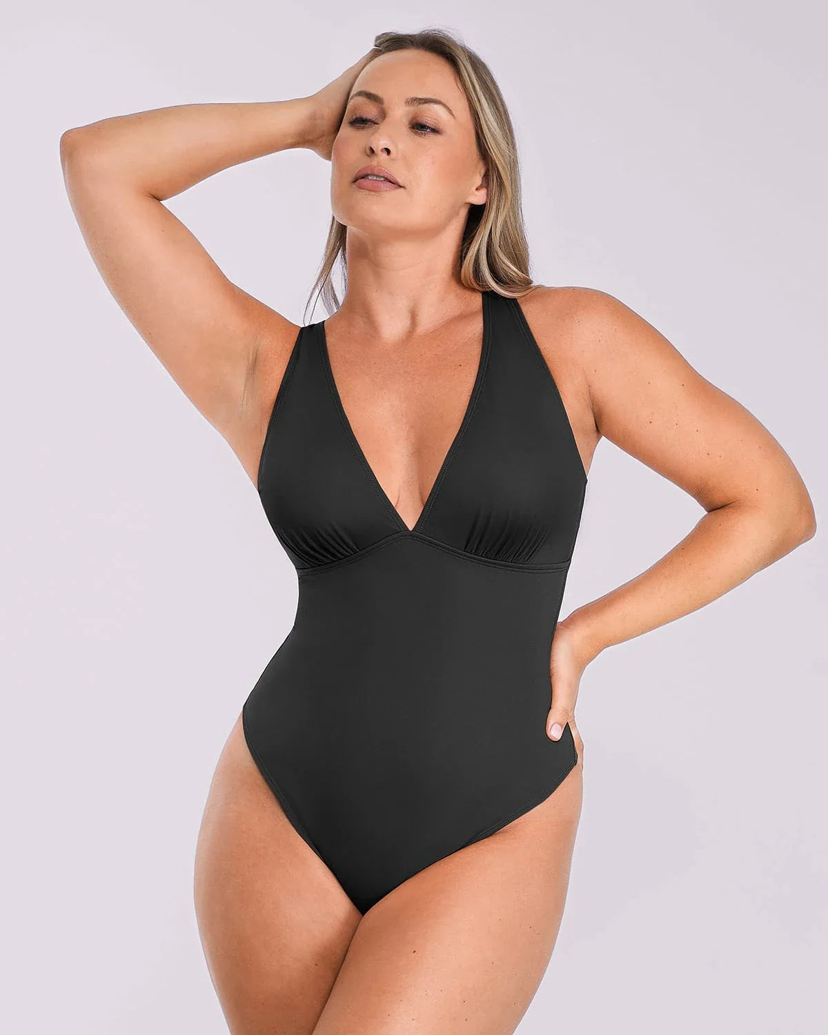 Bare Essentials™ AirSlim® Deep V-Neck Cross Back Thong Bodysuit