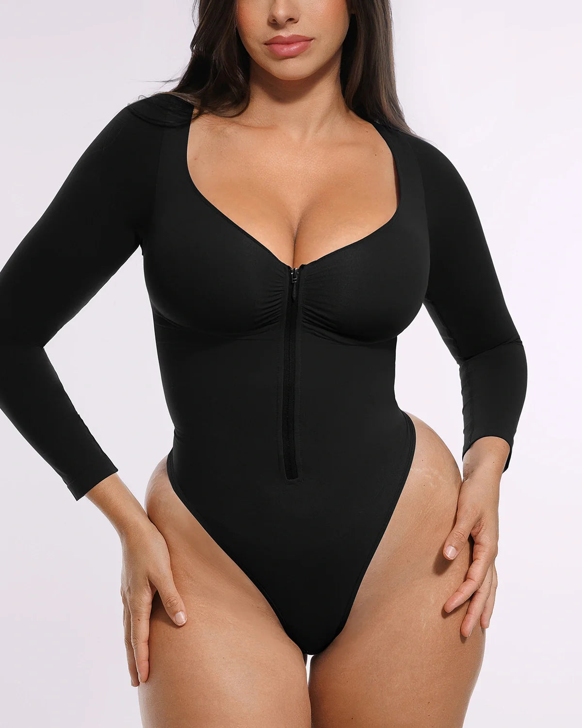 Bare Essentials™ Skin Flow Long Sleeve Zipper Front Thong Bodysuit